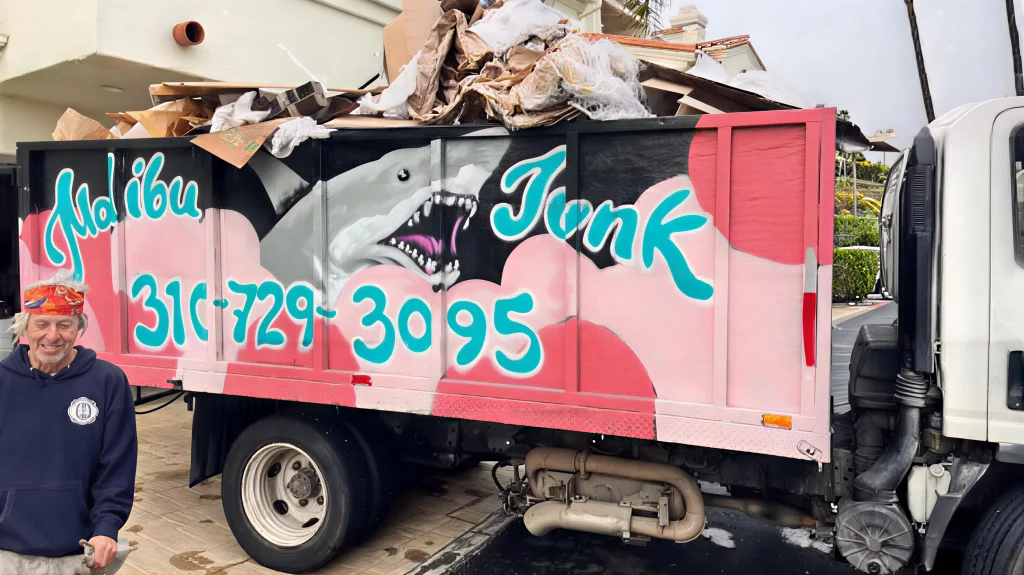 malibu junk removal owner, pepper foster standing in front of his truck